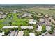 Aerial view highlighting the community's lush greenery, golf course, and surrounding landscape at 625 S Clinton St # 7A, Denver, CO 80247