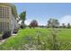 Landscaped backyard with trees and view of golf course at 625 S Clinton St # 7A, Denver, CO 80247