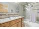 Bathroom with modern tile, glass shower doors, and updated vanity at 625 S Clinton St # 7A, Denver, CO 80247