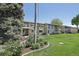 Apartment building at 625 S Clinton St with flowers and green lawn at 625 S Clinton St # 7A, Denver, CO 80247