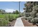 A beautifully landscaped walkway offers a serene path through the lush community grounds at 625 S Clinton St # 7A, Denver, CO 80247