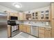 Well-lit kitchen with stainless steel appliances, ample cabinetry, and granite countertops at 625 S Clinton St # 7A, Denver, CO 80247