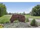Signage for Emerald Greens Golf Club situated amongst lush green grass and mature trees at 625 S Clinton St # 7A, Denver, CO 80247