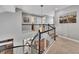 Spacious upstairs hallway with high ceilings and natural light at 12198 Tack Dr, Parker, CO 80134