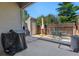 Back patio with a shed, grill, table, and chairs; great for outdoor entertaining at 4691 S Fraser Cir # A, Aurora, CO 80015