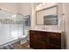 Bathroom featuring a glass shower, marbled vanity, and tiled flooring at 4691 S Fraser Cir # A, Aurora, CO 80015