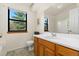 Simple, clean bathroom with a window providing natural light at 4691 S Fraser Cir # A, Aurora, CO 80015