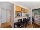 Charming dining room with hardwood floors and a view to the kitchen at 4691 S Fraser Cir # A, Aurora, CO 80015
