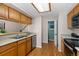 Well-lit kitchen featuring stainless steel appliances and hardwood floors at 4691 S Fraser Cir # A, Aurora, CO 80015