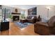 Cozy living room featuring a fireplace and a comfortable leather sectional at 4691 S Fraser Cir # A, Aurora, CO 80015