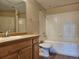 Bathroom featuring single sink vanity and shower over tub with tile surround at 15475 E Andrews Dr # 402, Denver, CO 80239