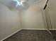 Bedroom featuring carpet, ceiling fan, and mirrored closet doors at 15475 E Andrews Dr # 402, Denver, CO 80239