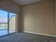 Bedroom featuring sliding glass doors to balcony at 15475 E Andrews Dr # 402, Denver, CO 80239