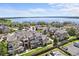 Scenic aerial view of lakeside townhomes, green lawns and water at 4760 S Wadsworth Blvd # K205, Littleton, CO 80123