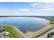 Wide aerial shot of the lake showcases serene waters and surrounding community at 4760 S Wadsworth Blvd # K205, Littleton, CO 80123