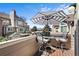 Charming balcony with seating and views of neighboring buildings and mountains in the distance at 4760 S Wadsworth Blvd # K205, Littleton, CO 80123