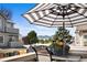 Relaxing balcony with a table and chairs, offering views of trees, mountains, and the sky at 4760 S Wadsworth Blvd # K205, Littleton, CO 80123