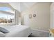 Bright bedroom with a large window, vaulted ceilings, and neutral decor at 4760 S Wadsworth Blvd # K205, Littleton, CO 80123
