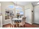 Charming dining area featuring hardwood floors and large windows at 4760 S Wadsworth Blvd # K205, Littleton, CO 80123