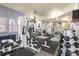 Bright exercise room with weightlifting machines, free weights, and mirrors at 4760 S Wadsworth Blvd # K205, Littleton, CO 80123