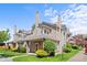 Charming townhome showcasing landscaped front yard and neutral siding at 4760 S Wadsworth Blvd # K205, Littleton, CO 80123