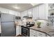 Bright kitchen with stainless steel appliances and granite countertops at 4760 S Wadsworth Blvd # K205, Littleton, CO 80123