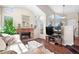 Inviting living room with brick fireplace and plenty of natural light at 4760 S Wadsworth Blvd # K205, Littleton, CO 80123