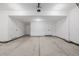 Large garage featuring white walls, concrete floors and ample storage space at 2361 Junegrass Ln, Louisville, CO 80027