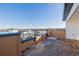 Outdoor patio with wood-look tile and a protective railing showcasing neighborhood views at 2361 Junegrass Ln, Louisville, CO 80027