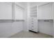 Walk-in closet with custom shelving and drawers providing ample storage space at 2361 Junegrass Ln, Louisville, CO 80027