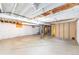 Unfinished basement space with exposed ceiling beams and concrete floor, offering potential for customization at 2630 W Asbury Ave, Denver, CO 80219