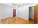 Cozy bedroom with wood floors, closet, and doorway to the next room, great layout at 2630 W Asbury Ave, Denver, CO 80219