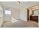 Bright bedroom with a window allowing for ample natural light and an attached bathroom at 17040 Galapago Ct, Broomfield, CO 80023