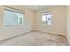 Bright bedroom with neutral carpet and large windows offering natural light at 17040 Galapago Ct, Broomfield, CO 80023