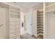 Walk-in closet with custom shelving and ample storage solutions at 17040 Galapago Ct, Broomfield, CO 80023
