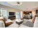 Open-concept living room offers great views of the kitchen and an outside patio at 17040 Galapago Ct, Broomfield, CO 80023