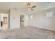 Large primary bedroom with neutral carpet and an attached bathroom with a separate tub at 17040 Galapago Ct, Broomfield, CO 80023