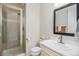 Clean bathroom with a glass shower, vanity, and modern fixtures at 1195 Fox Hills Ct, Erie, CO 80516