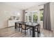 Elegant dining area with modern table set and sliding doors to outdoor living at 1195 Fox Hills Ct, Erie, CO 80516