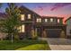 Beautiful two-story home with stone accents, green lawn, and a two car garage, perfect for Gathering living at 1195 Fox Hills Ct, Erie, CO 80516