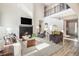 Bright living room features a fireplace, soaring ceilings and a second story overlook at 1195 Fox Hills Ct, Erie, CO 80516