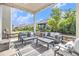 Covered outdoor patio with stylish seating and decor, perfect for relaxation and entertaining at 1195 Fox Hills Ct, Erie, CO 80516