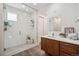 Beautiful bathroom with a glass-enclosed shower, modern vanity, and stylish finishes at 2339 W 66Th Ave, Denver, CO 80221