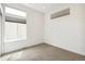 Bright bedroom with large windows and neutral tones, offering a versatile space at 2339 W 66Th Ave, Denver, CO 80221