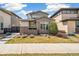 Inviting home with a green door, modern landscaping, and a well-maintained walkway leading to the entrance at 2339 W 66Th Ave, Denver, CO 80221