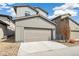 Attached two-car garage and driveway providing ample parking at this modern home at 2339 W 66Th Ave, Denver, CO 80221