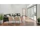 Inviting living room showcases wood flooring, stylish seating arrangement, and natural light from sliding glass doors at 2339 W 66Th Ave, Denver, CO 80221