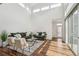 Spacious living area with vaulted ceilings, hardwood floors, modern decor, and ample natural light at 2339 W 66Th Ave, Denver, CO 80221