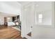 Open-concept living space with a modern kitchen, breakfast bar seating, and view of the living room at 2339 W 66Th Ave, Denver, CO 80221
