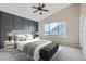 Bedroom featuring a dark accent wall, vaulted ceiling, and carpeted floor at 4296 Clover Ln, Brighton, CO 80601